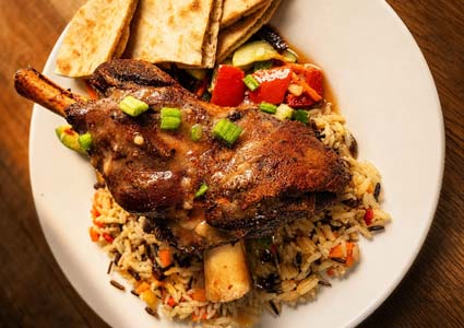 Roasted lamb shank on rice with vegetables, from Torey’s Restaurant & Bar in Owatonna.